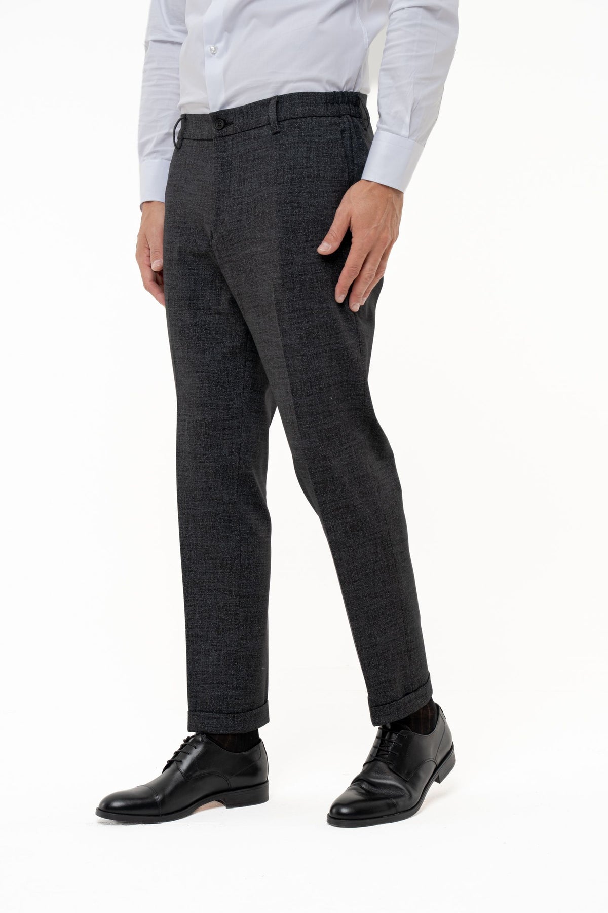 Pantaloni con risvolto in microfantasia